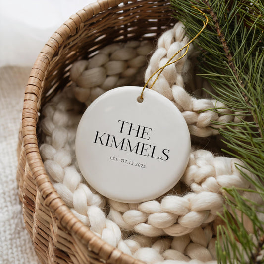 Personalized Ceramic Ornament Wedding Gift Custom Family Name Establishment Date First Christmas Together Newlywed Present White Round Design Gold String Accent Modern Minimalist Style Holiday Keepsake Memory Custom Family Tradition Special